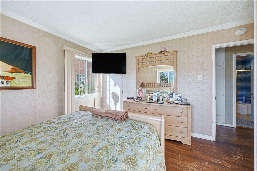 117 Spanner Street Monrovia, CA 91016 - Photo 16 of 33 a bedroom with a bed and a flat screen tv