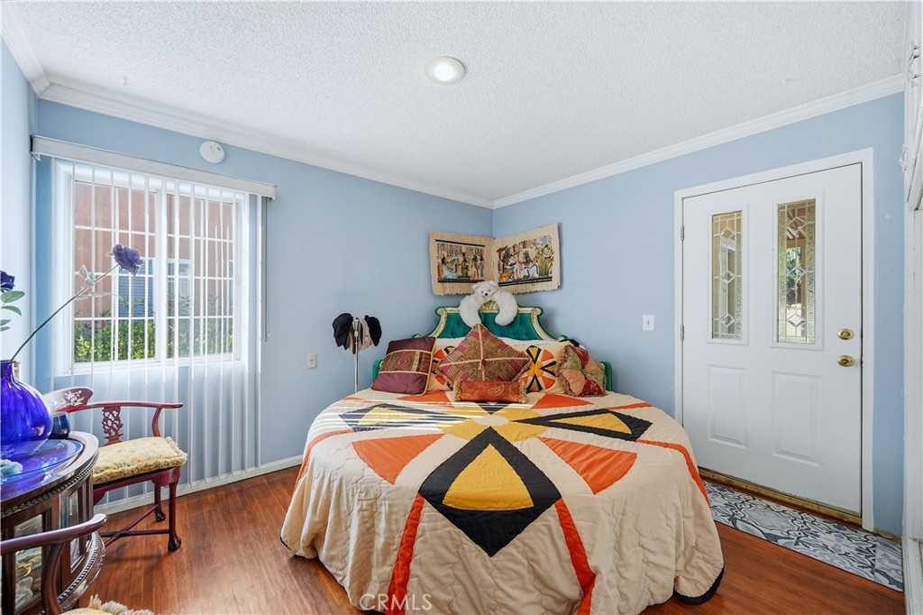 117 Spanner Street Monrovia, CA 91016 - Photo 17 of 33 a bedroom with a bed and wooden floor