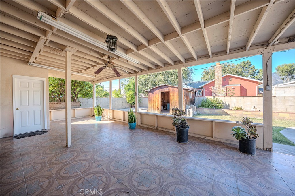 117 Spanner Street Monrovia, CA 91016 - Photo 22 of 33 a view of a patio with a table and chairs under an umbrella with a patio