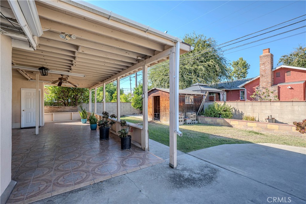 117 Spanner Street Monrovia, CA 91016 - Photo 24 of 33 a view of a patio with a table and chairs under an umbrella