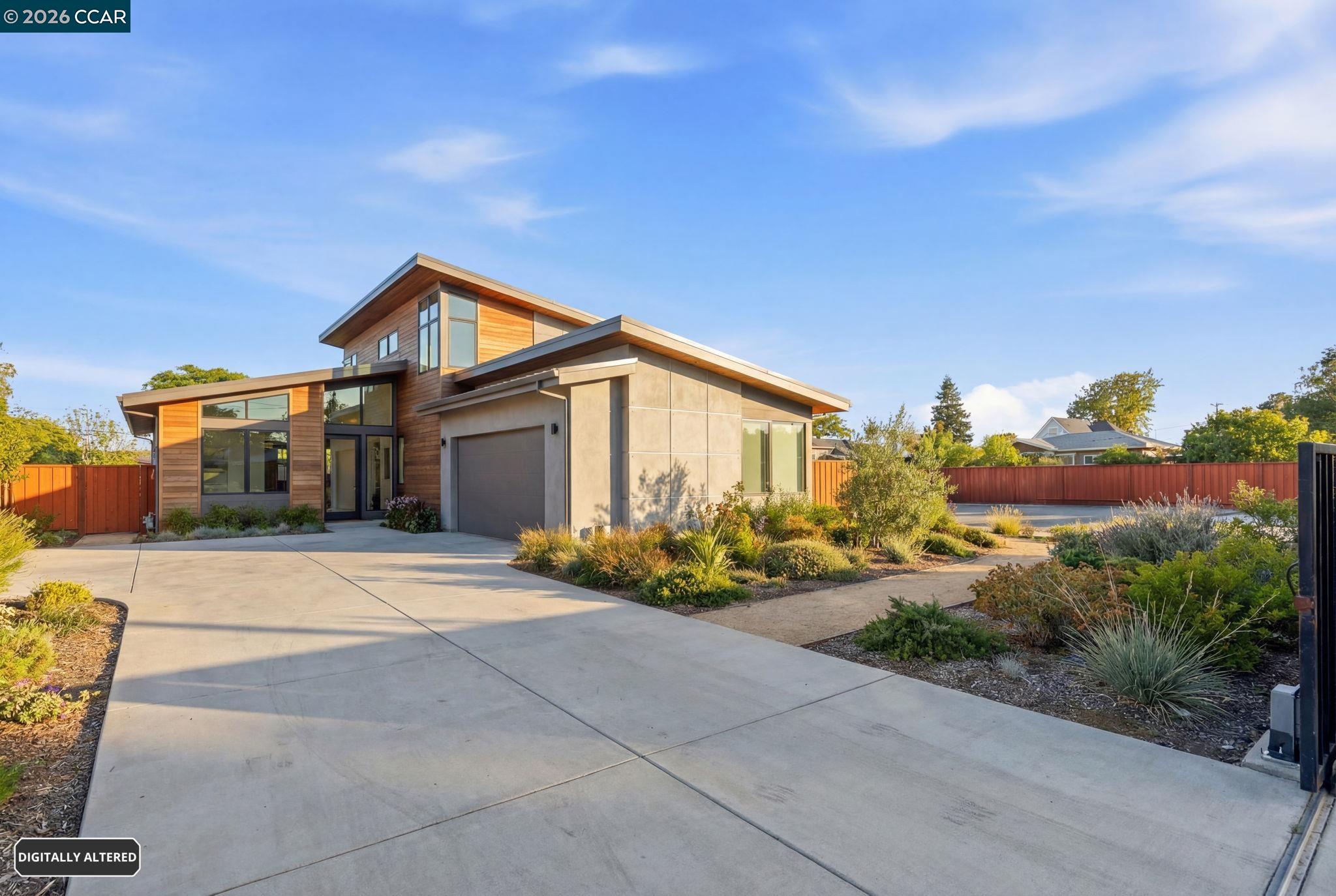 205 Solano Avenue Bay Point, CA 94565 - Photo 4 of 16 a front view of a house with a yard and garage