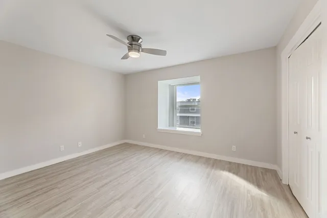 a bathroom with a granite countertop sink mirror toilet and bathtub