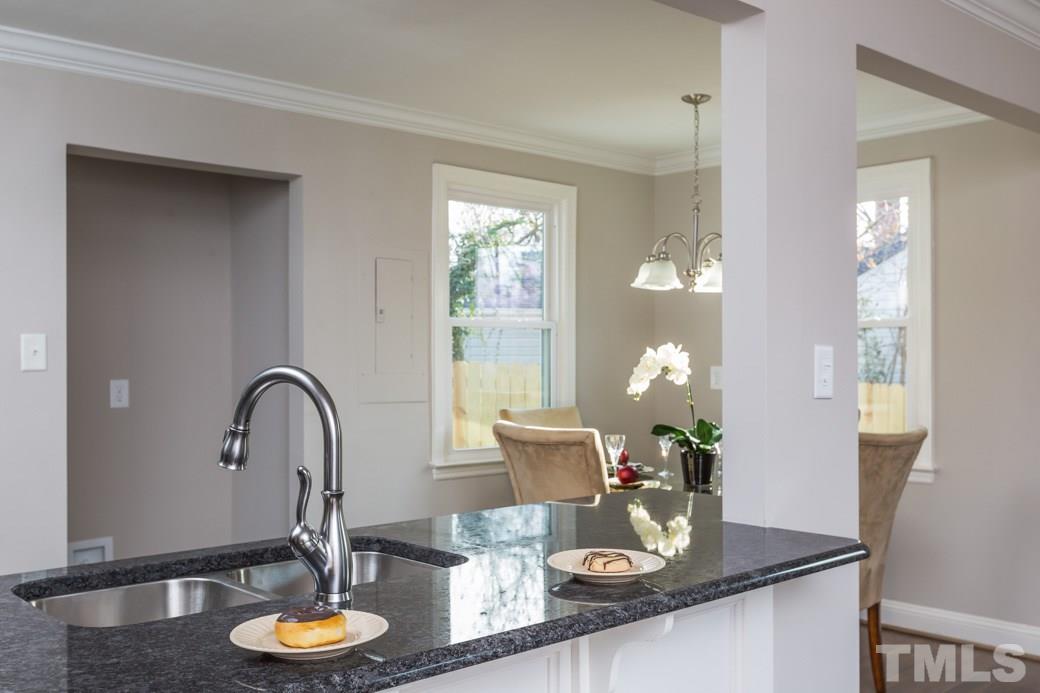 820 Colleton Road Raleigh, NC 27610 - Photo 11 of 25 a kitchen with a table and chairs in it