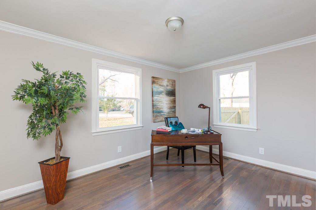 820 Colleton Road Raleigh, NC 27610 - Photo 16 of 25 a living room with furniture and a potted plant