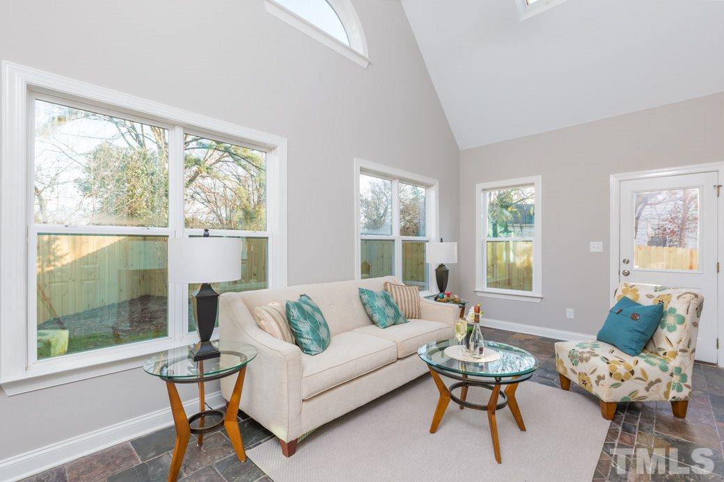 820 Colleton Road Raleigh, NC 27610 - Photo 3 of 25 a living room with furniture and a large window