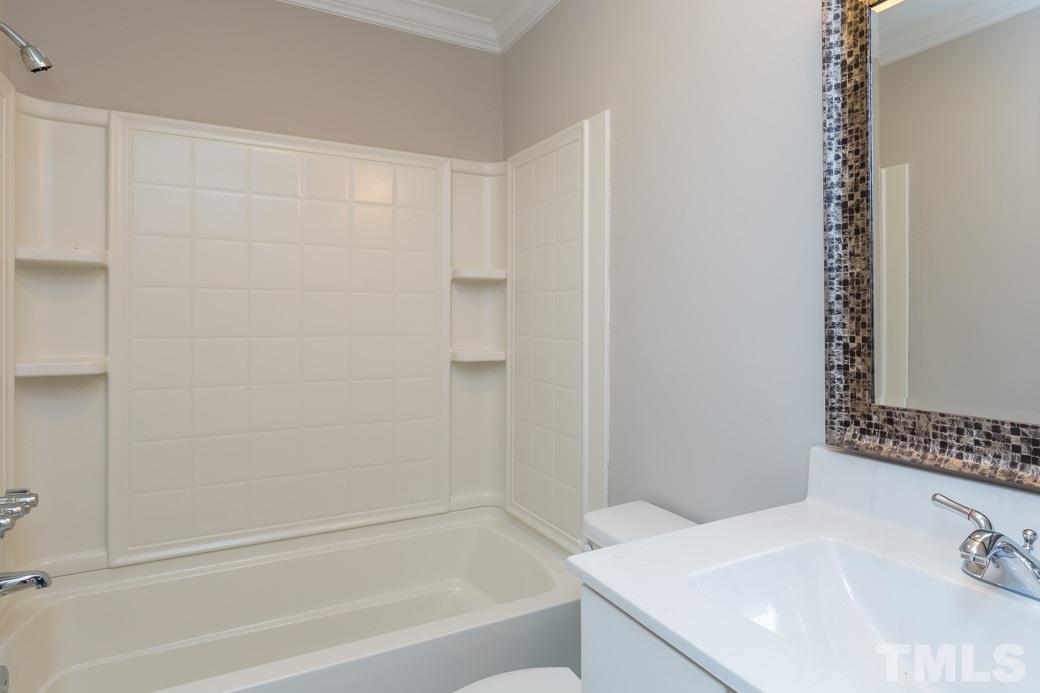 820 Colleton Road Raleigh, NC 27610 - Photo 22 of 25 a bathroom with a sink and a bathtub