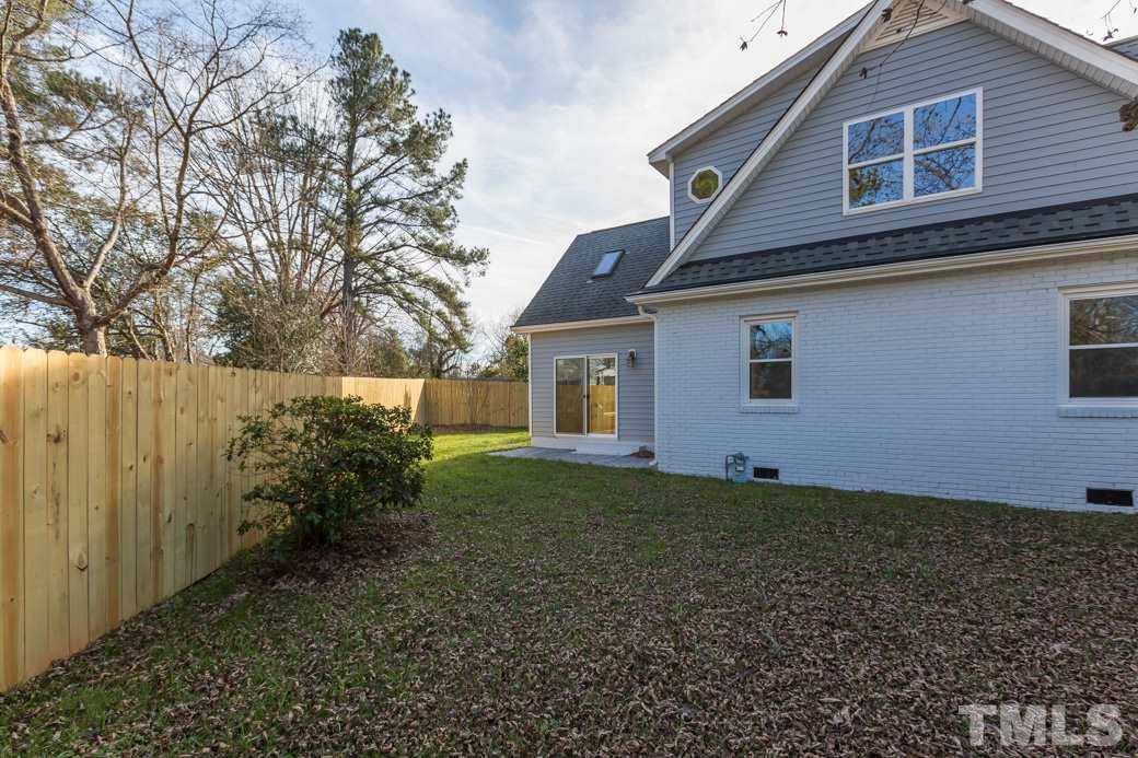 820 Colleton Road Raleigh, NC 27610 - Photo 24 of 25 a house that has a backyard