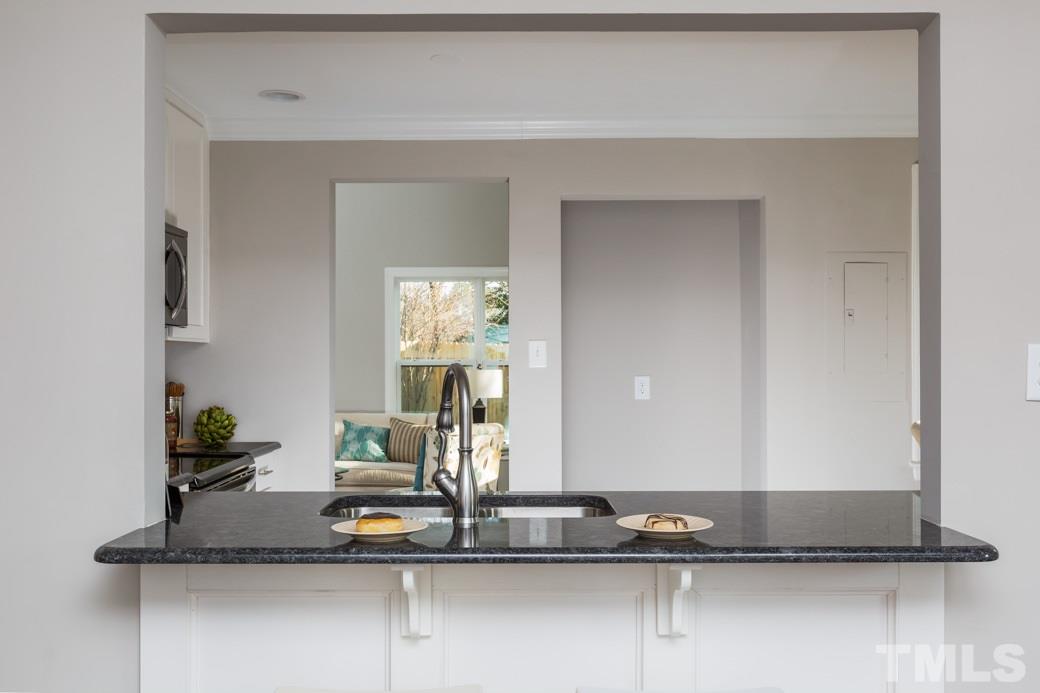 820 Colleton Road Raleigh, NC 27610 - Photo 10 of 25 a view of a living room with a sink and gym equipment