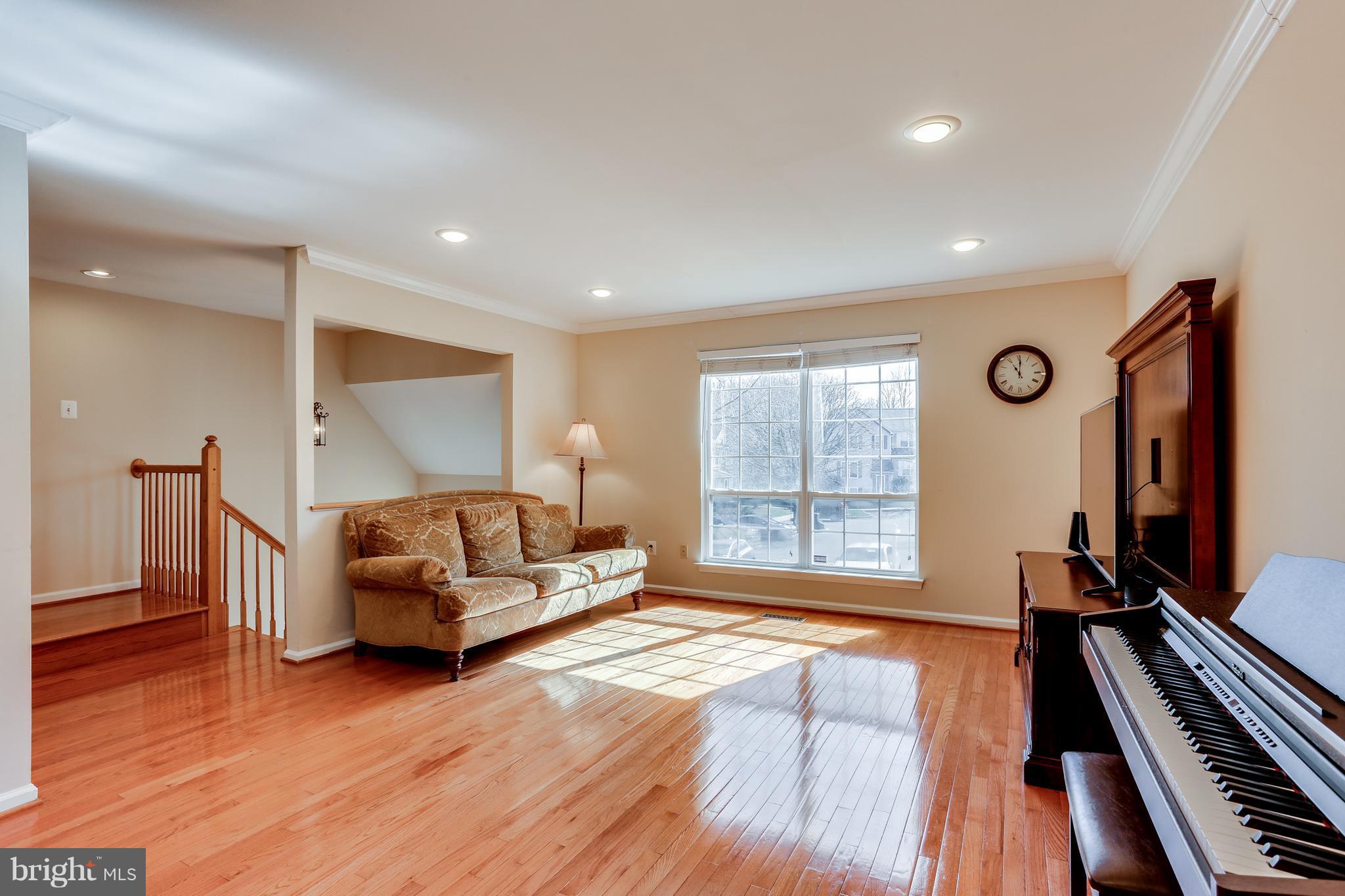 6141 Good Hunters Ride Columbia, MD 21045 - Photo 2 of 28 a living room with furniture and a flat screen tv