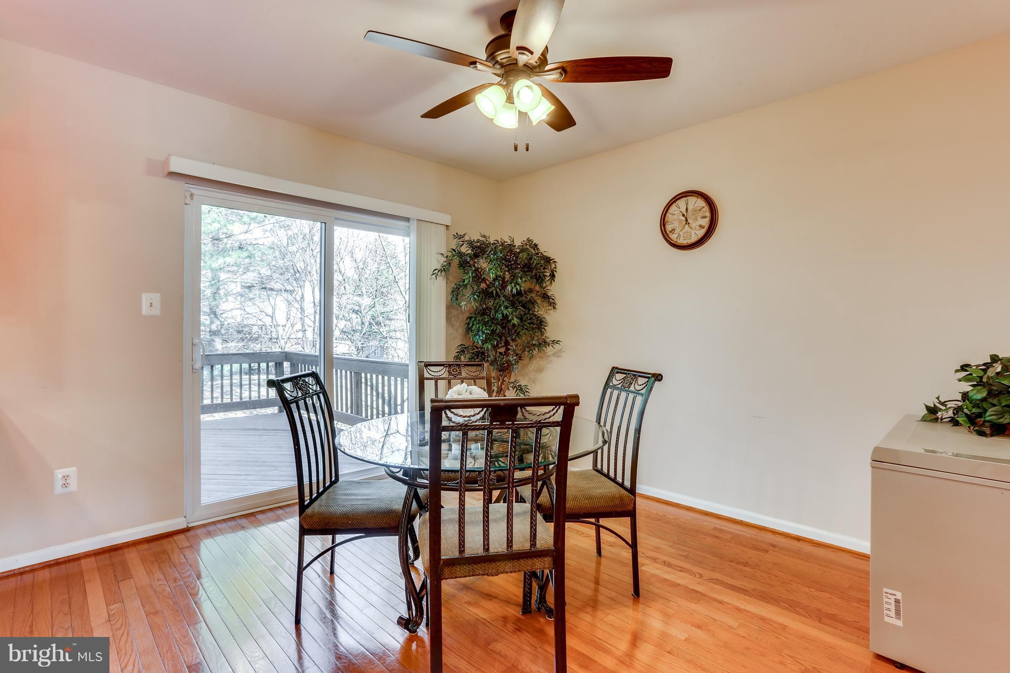 6141 Good Hunters Ride Columbia, MD 21045 - Photo 11 of 28 a view of a dining room with furniture window and wooden floor