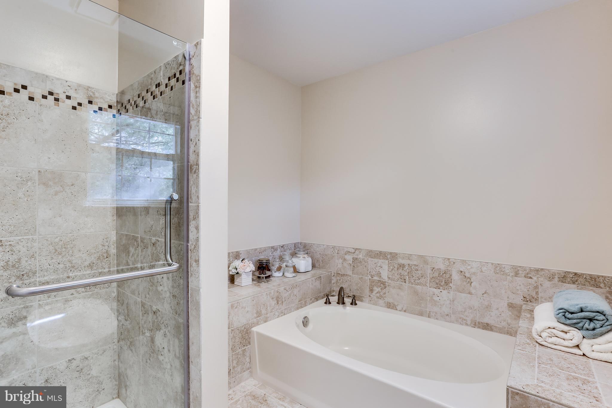 6141 Good Hunters Ride Columbia, MD 21045 - Photo 17 of 28 a bathroom with a bathtub and shower