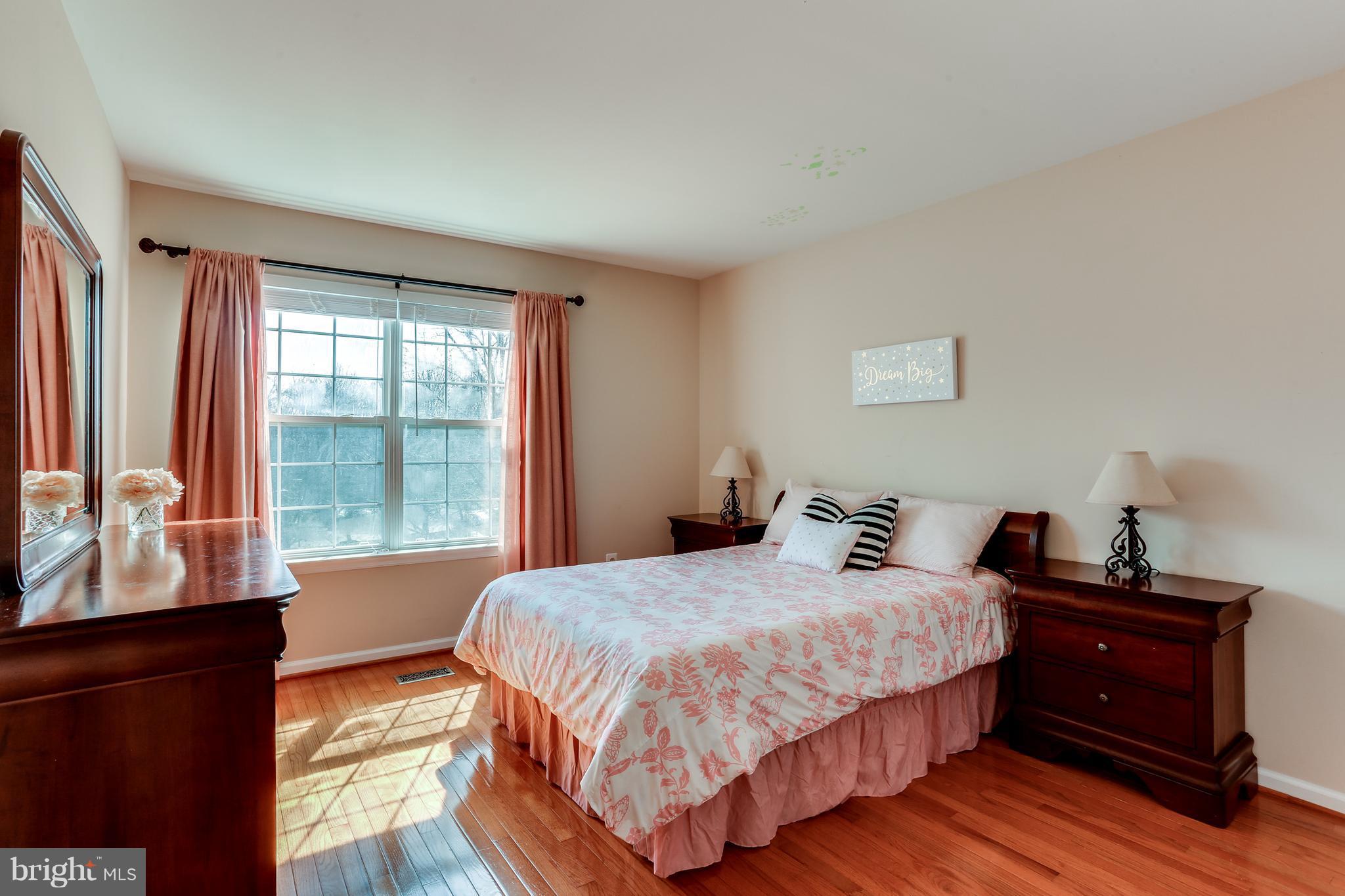 6141 Good Hunters Ride Columbia, MD 21045 - Photo 18 of 28 a bedroom with a bed and a window