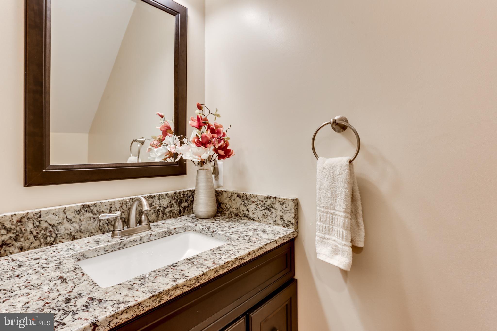 6141 Good Hunters Ride Columbia, MD 21045 - Photo 22 of 28 a bathroom with a granite countertop sink and a mirror