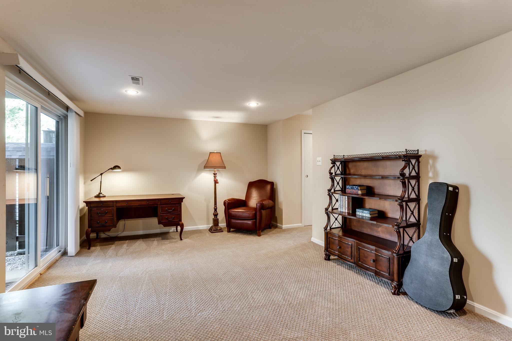 6141 Good Hunters Ride Columbia, MD 21045 - Photo 24 of 28 a bedroom with furniture and a lamp