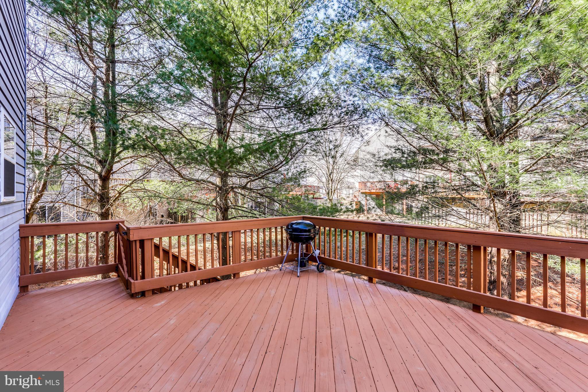 6141 Good Hunters Ride Columbia, MD 21045 - Photo 27 of 28 a view of deck with two chairs and wooden floor