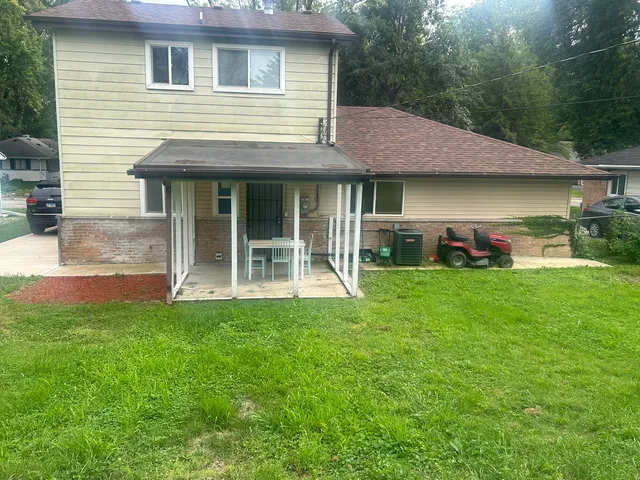 a front view of a house with a garden and porch