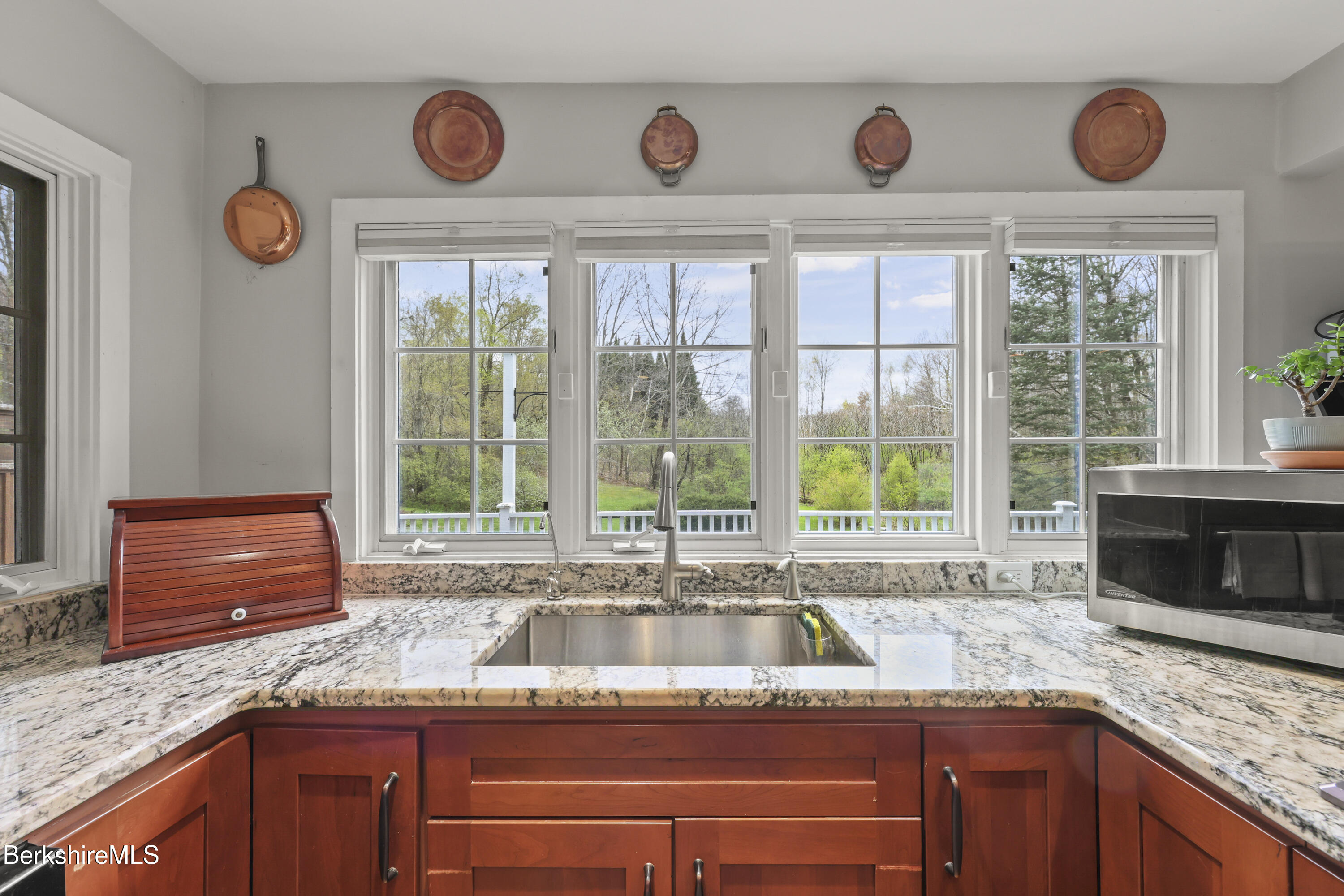 167 Bailey Road Lanesborough, MA 01237 - Photo 11 of 71 a kitchen with granite countertop a stove a sink and a microwave