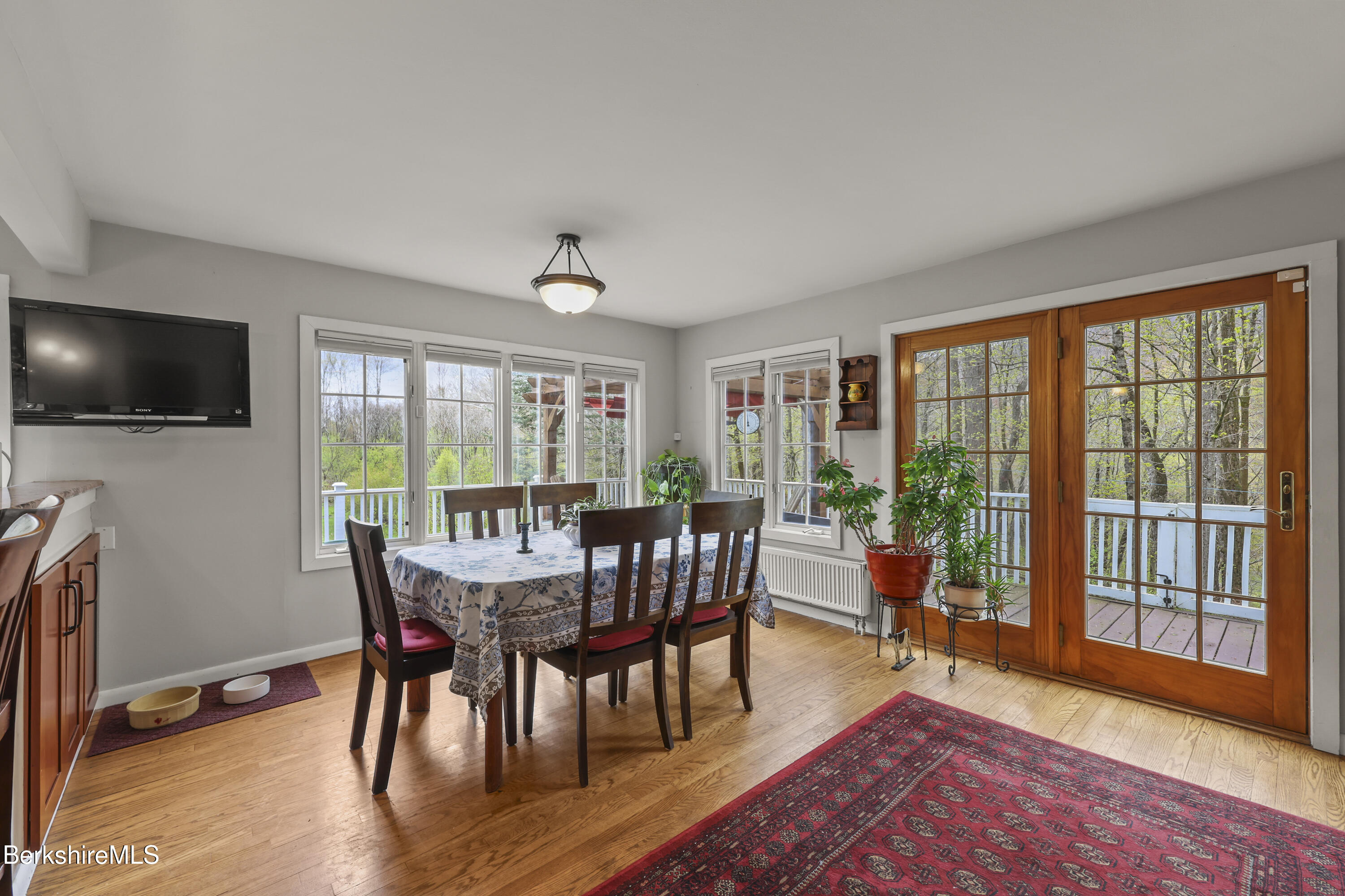 167 Bailey Road Lanesborough, MA 01237 - Photo 13 of 71 a view of a dining room with furniture window and wooden floor