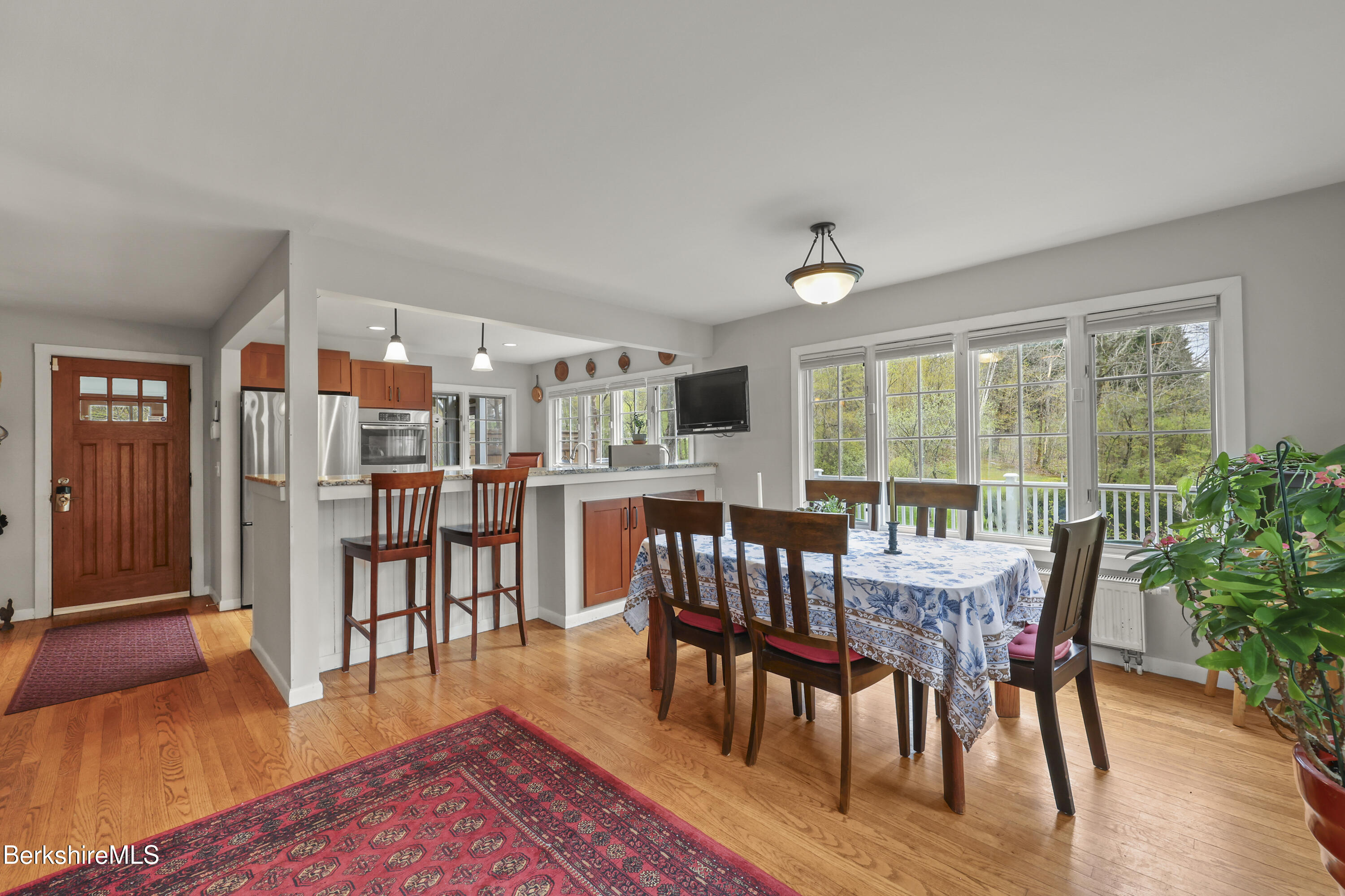 167 Bailey Road Lanesborough, MA 01237 - Photo 15 of 71 a dining room with furniture window and wooden floor