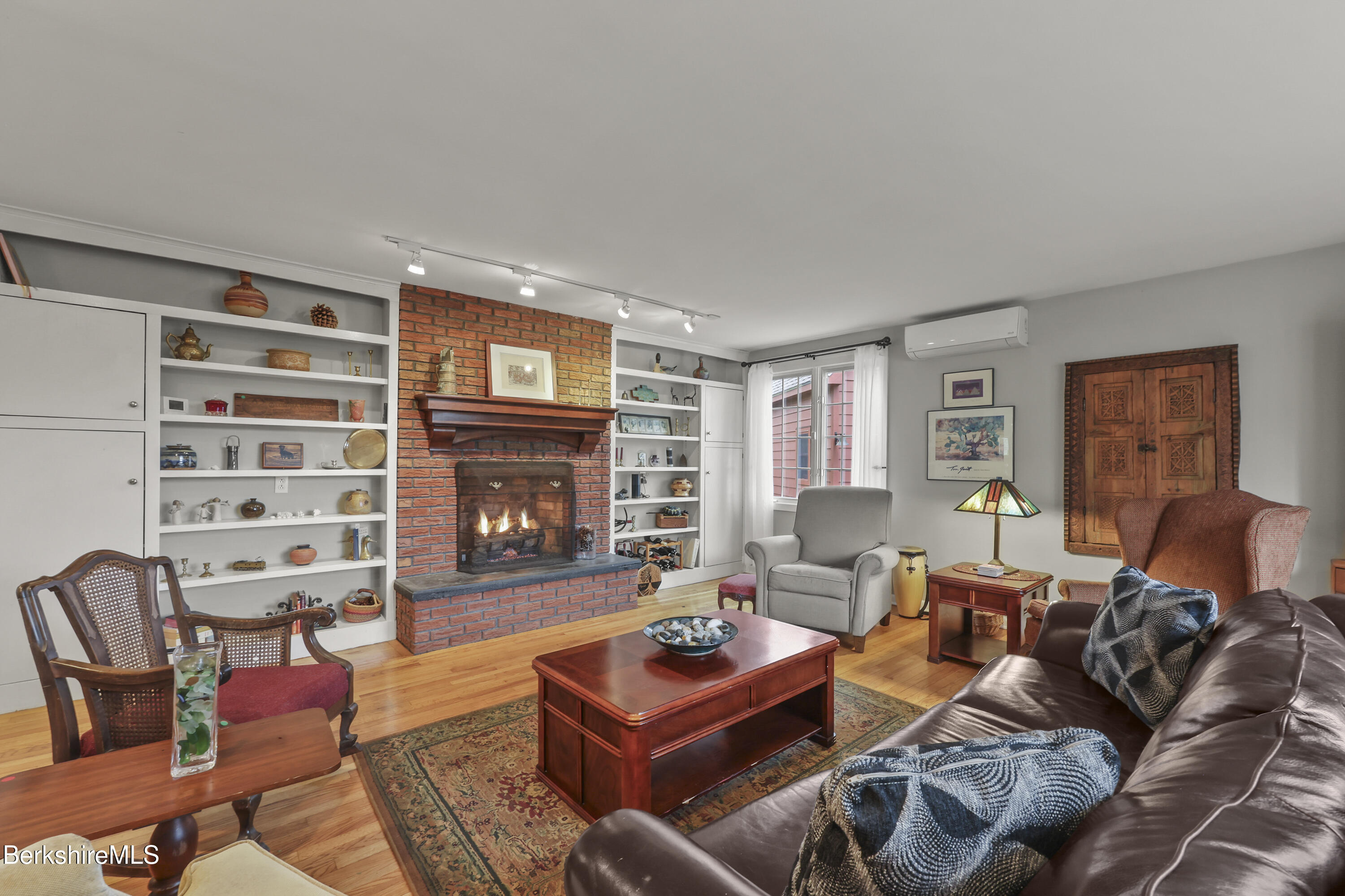 167 Bailey Road Lanesborough, MA 01237 - Photo 21 of 71 a living room with furniture and a fireplace