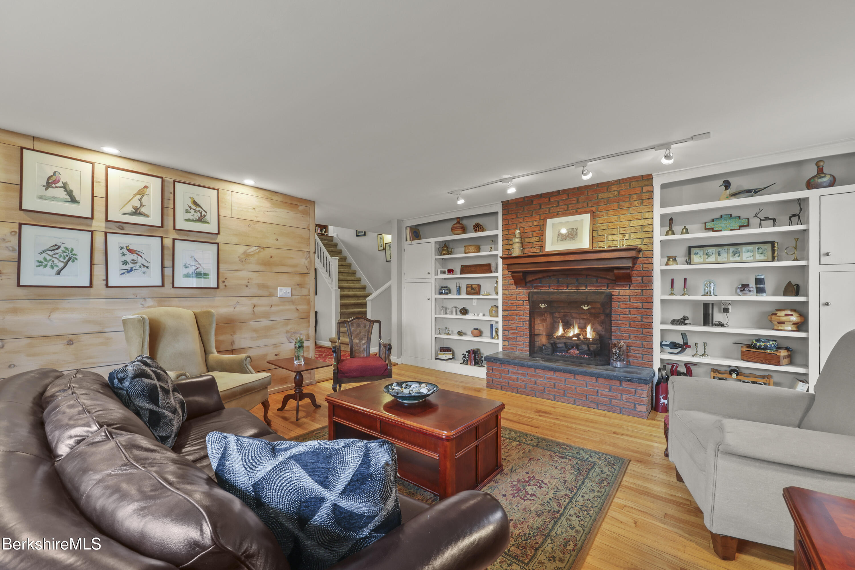 167 Bailey Road Lanesborough, MA 01237 - Photo 22 of 71 a living room with furniture and a fireplace