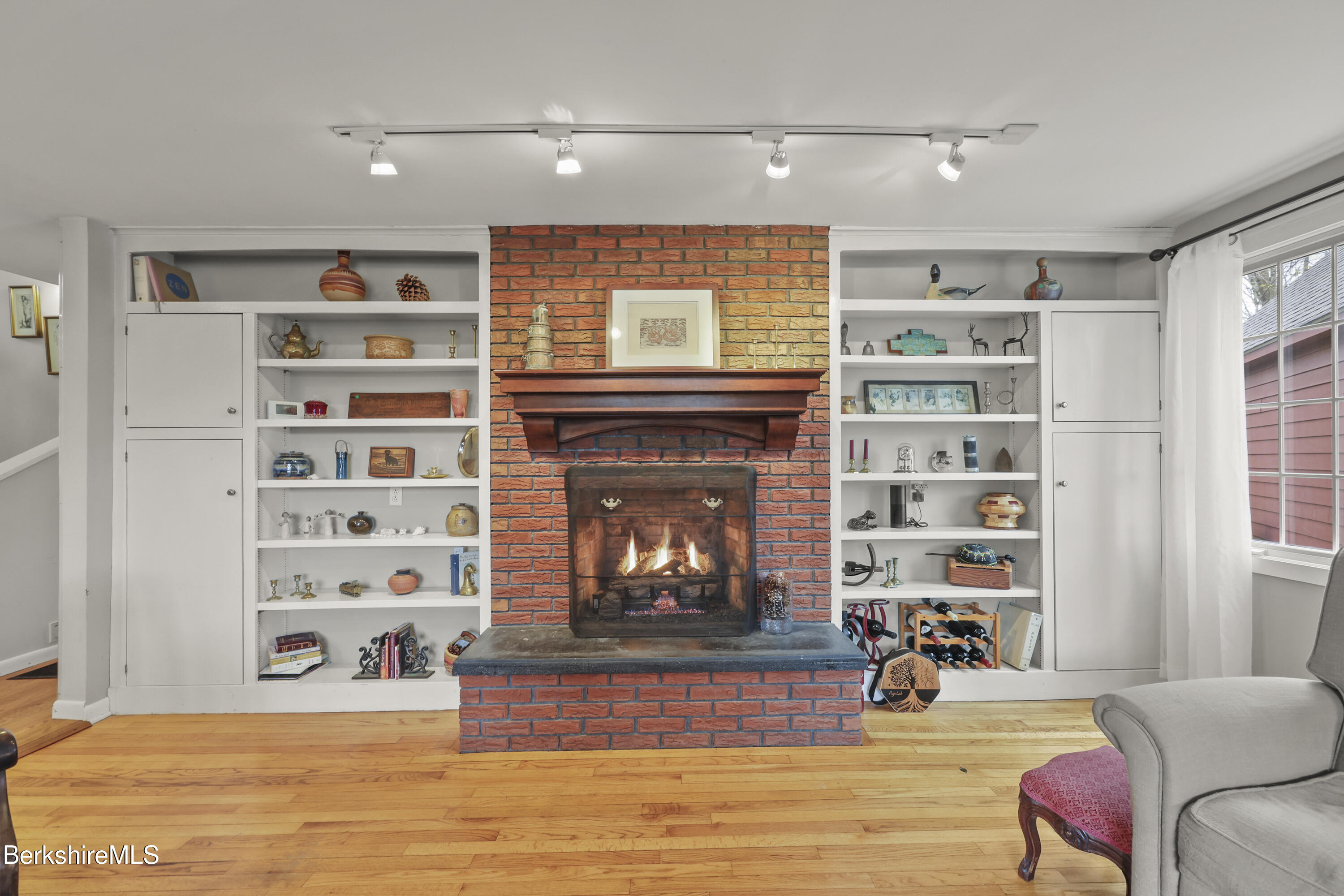 167 Bailey Road Lanesborough, MA 01237 - Photo 24 of 71 a living room with furniture and a fireplace