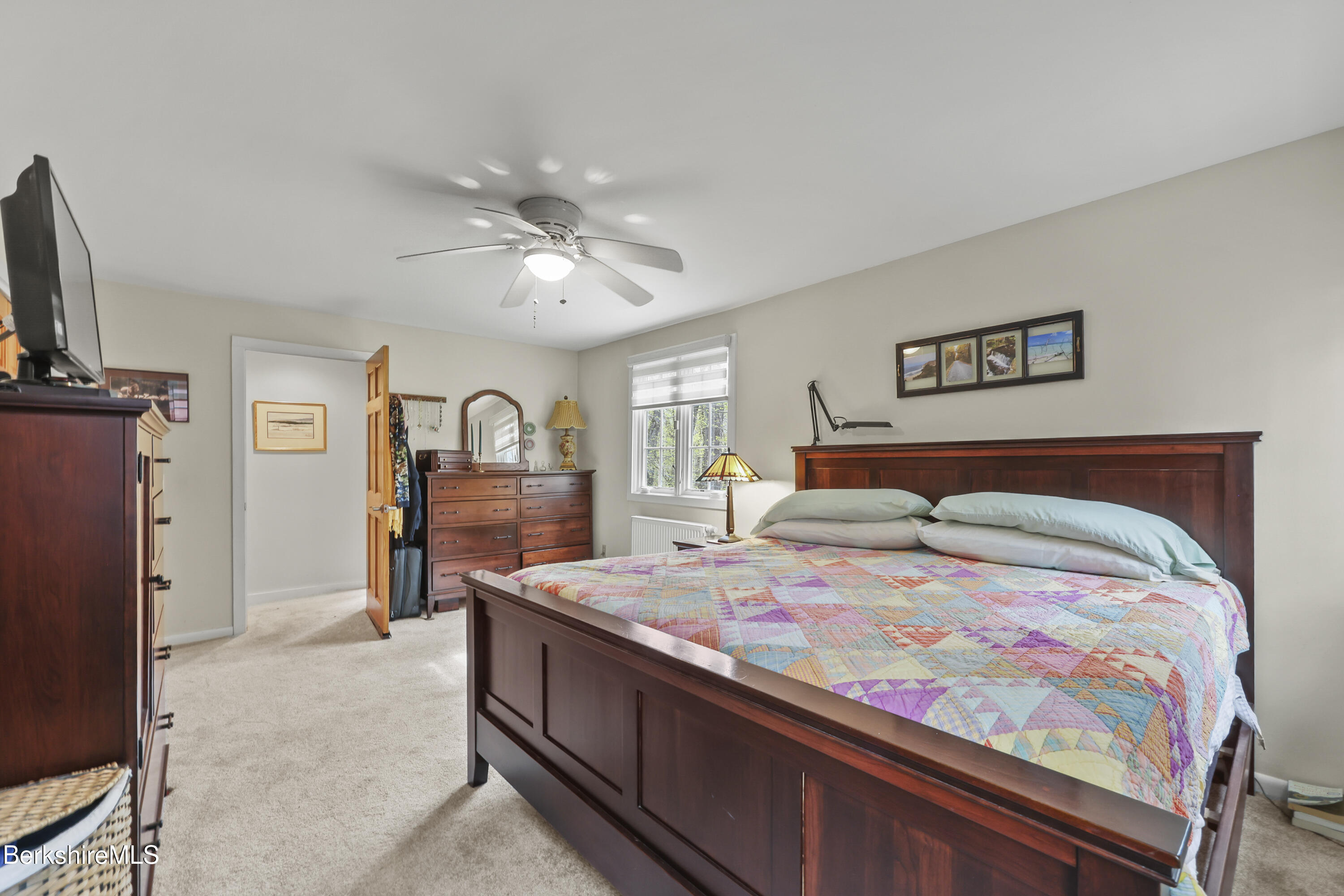 167 Bailey Road Lanesborough, MA 01237 - Photo 28 of 71 a bedroom with a bed and a tv on the dresser