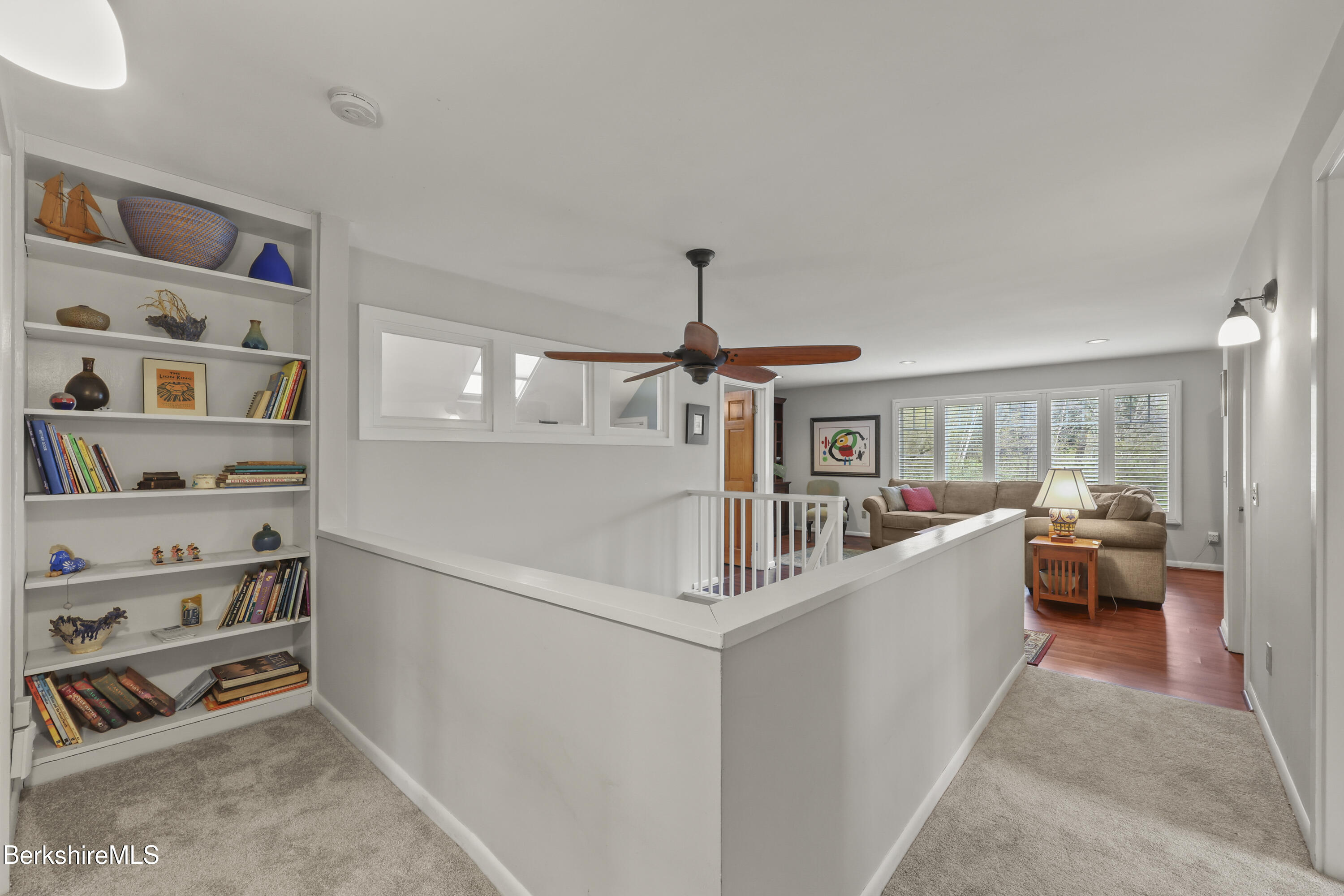 167 Bailey Road Lanesborough, MA 01237 - Photo 36 of 71 a living room with furniture and a book shelf