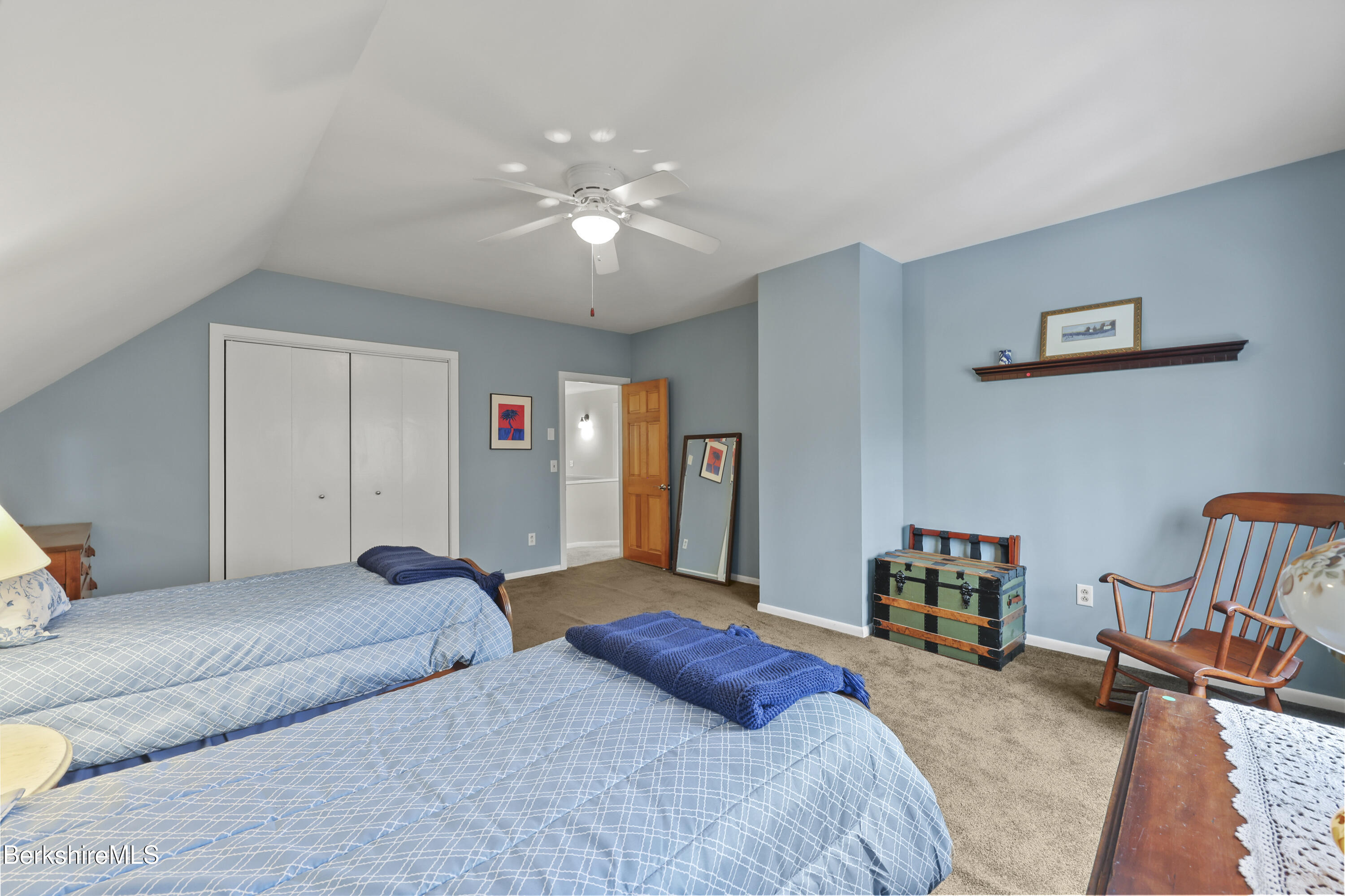 167 Bailey Road Lanesborough, MA 01237 - Photo 38 of 71 a bedroom with a bed and a chandelier