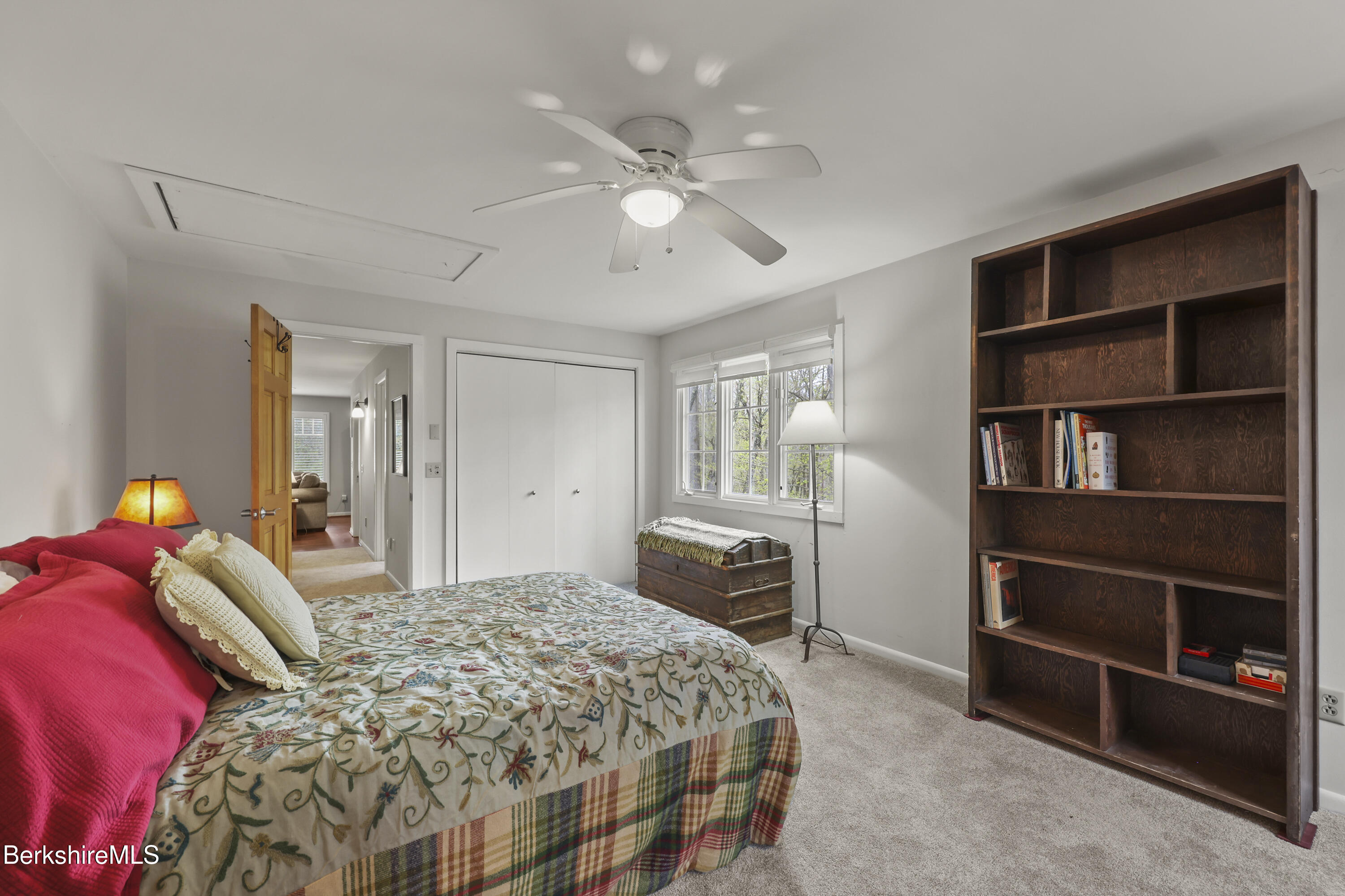 167 Bailey Road Lanesborough, MA 01237 - Photo 41 of 71 a bedroom with a bed and a chandelier