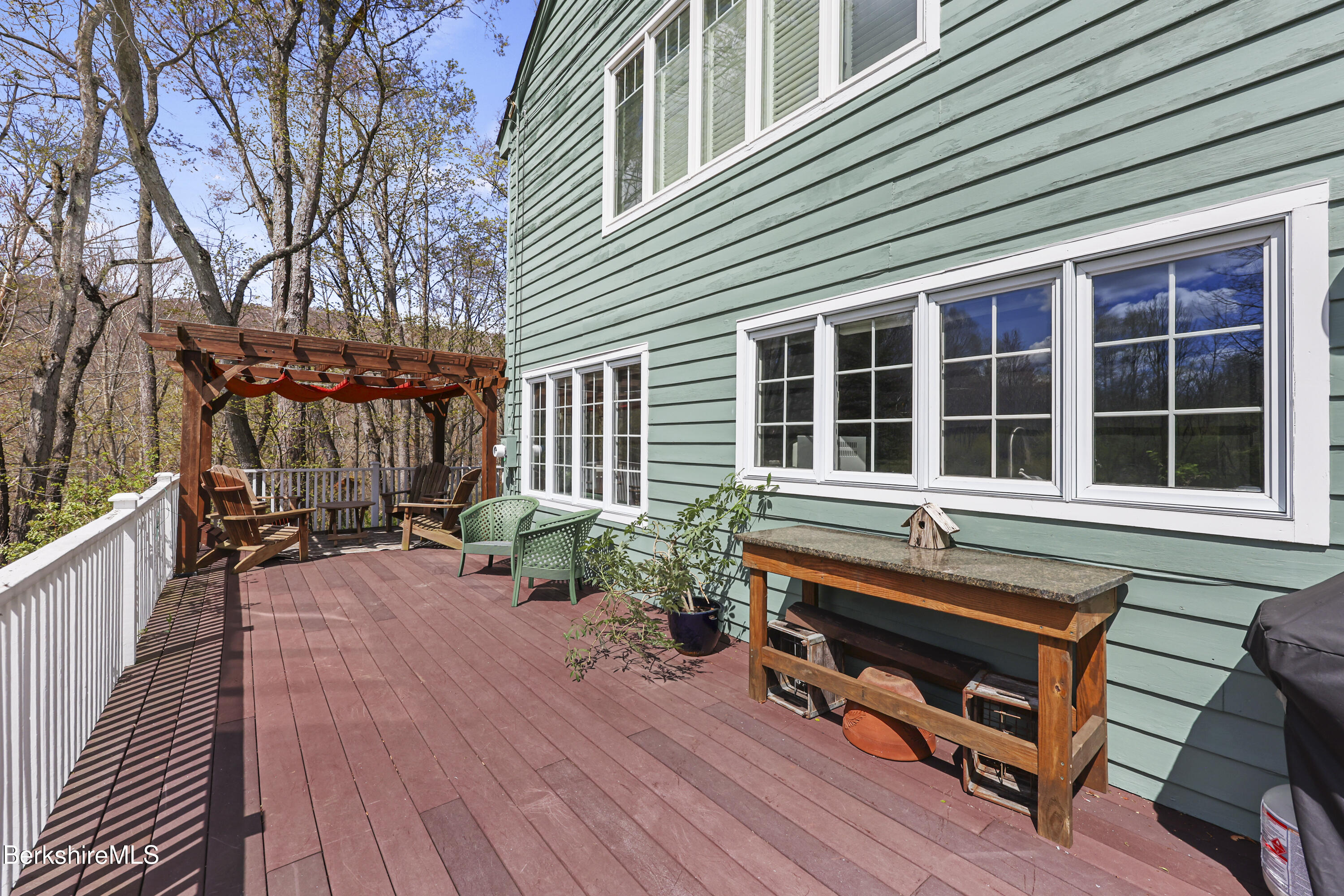 167 Bailey Road Lanesborough, MA 01237 - Photo 48 of 71 a backyard of a house with wooden floor and outdoor seating