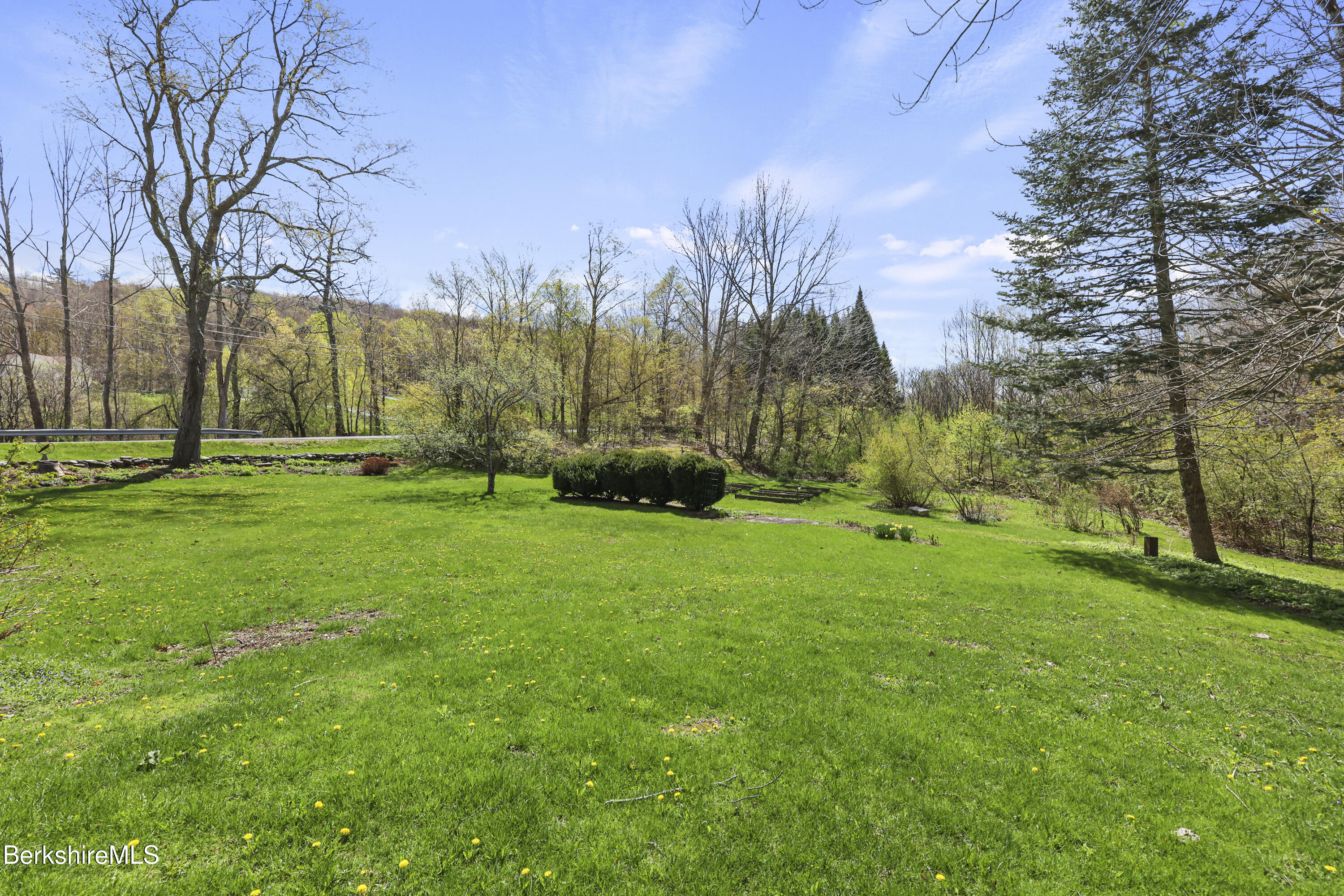167 Bailey Road Lanesborough, MA 01237 - Photo 60 of 71 a backyard of a house with lots of green space and fountain