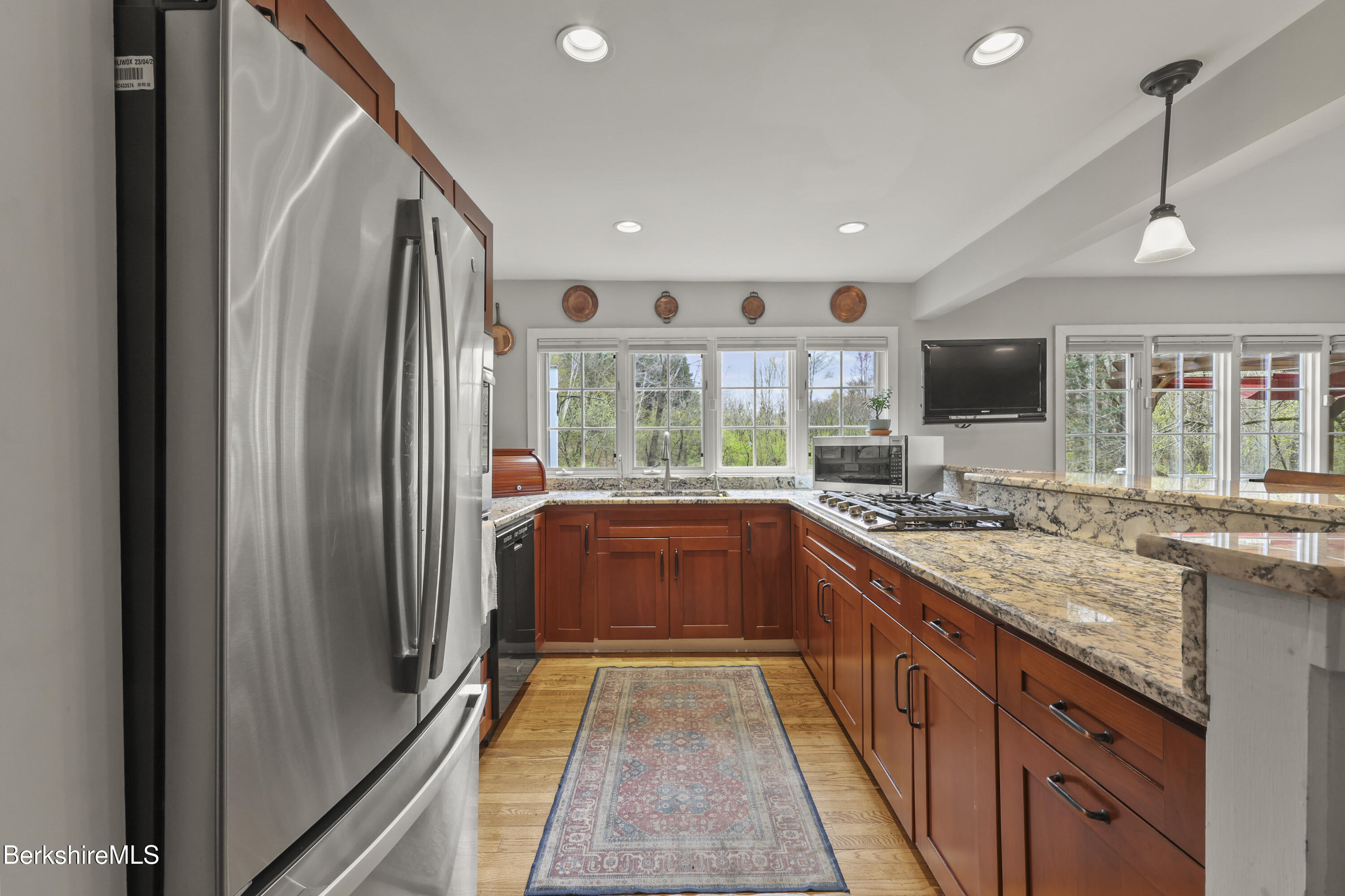 167 Bailey Road Lanesborough, MA 01237 - Photo 8 of 71 a large kitchen with stainless steel appliances granite countertop a refrigerator and a sink