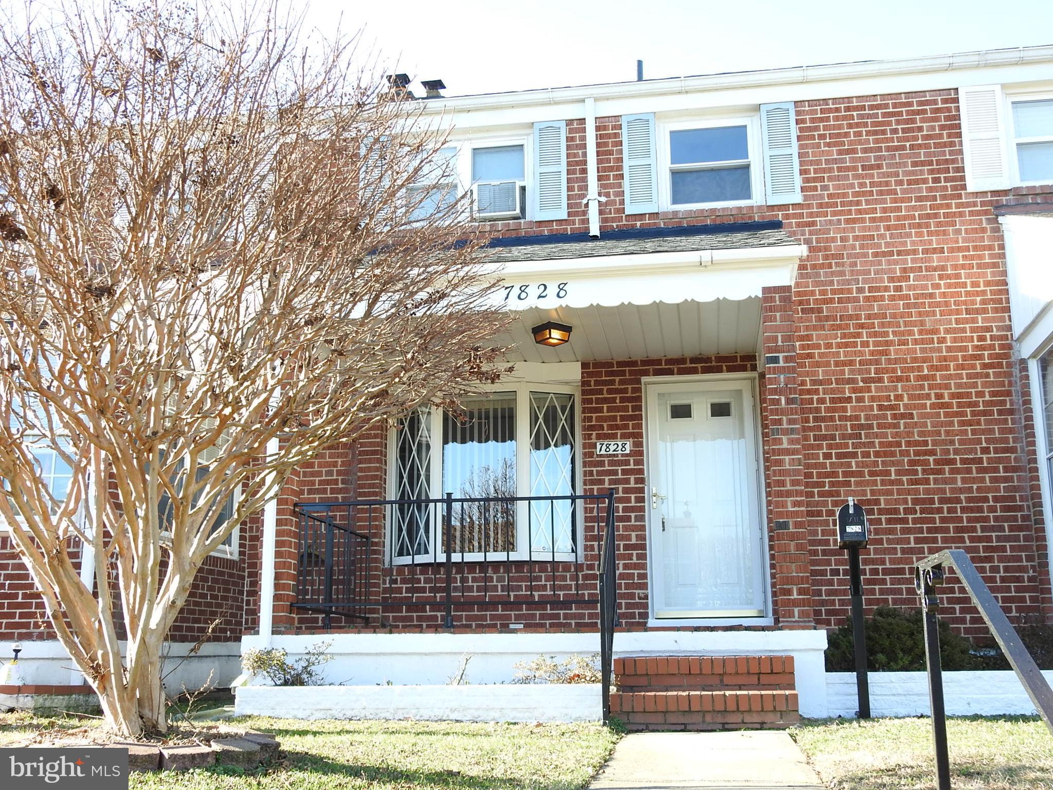 7828 Charlesmont Road Baltimore, MD 21222 - Photo 1 of 22 a front view of a house with street