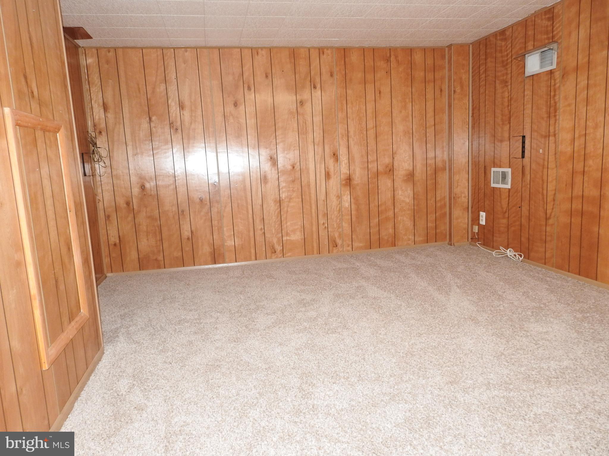 7828 Charlesmont Road Baltimore, MD 21222 - Photo 17 of 22 a view of an empty room with a window