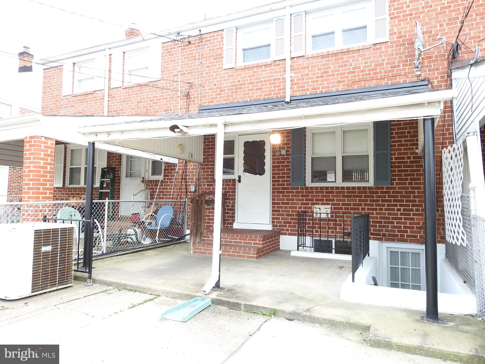 7828 Charlesmont Road Baltimore, MD 21222 - Photo 19 of 22 a view of a building with a parking space