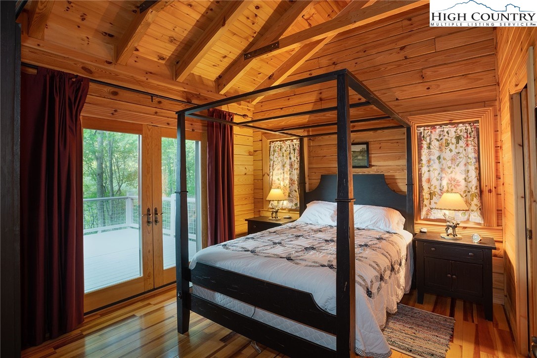 1082 Fox Cove Road Ferguson, NC 28624 - Photo 11 of 22 a bedroom with a bed and a window
