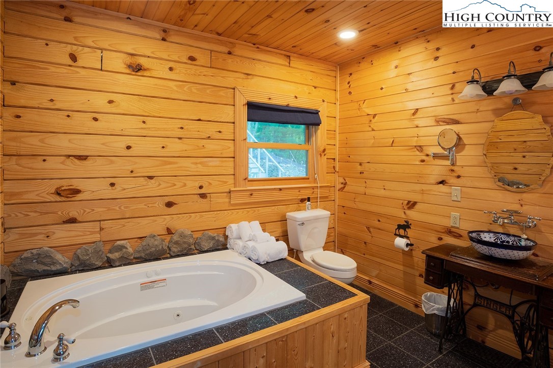 1082 Fox Cove Road Ferguson, NC 28624 - Photo 12 of 22 a bathroom with a sink and a toilet