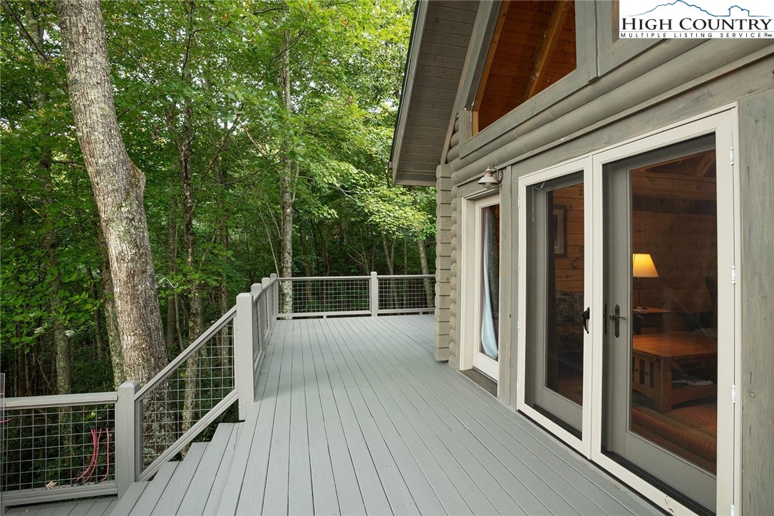 1082 Fox Cove Road Ferguson, NC 28624 - Photo 20 of 22 a view of a balcony with wooden floor and fence