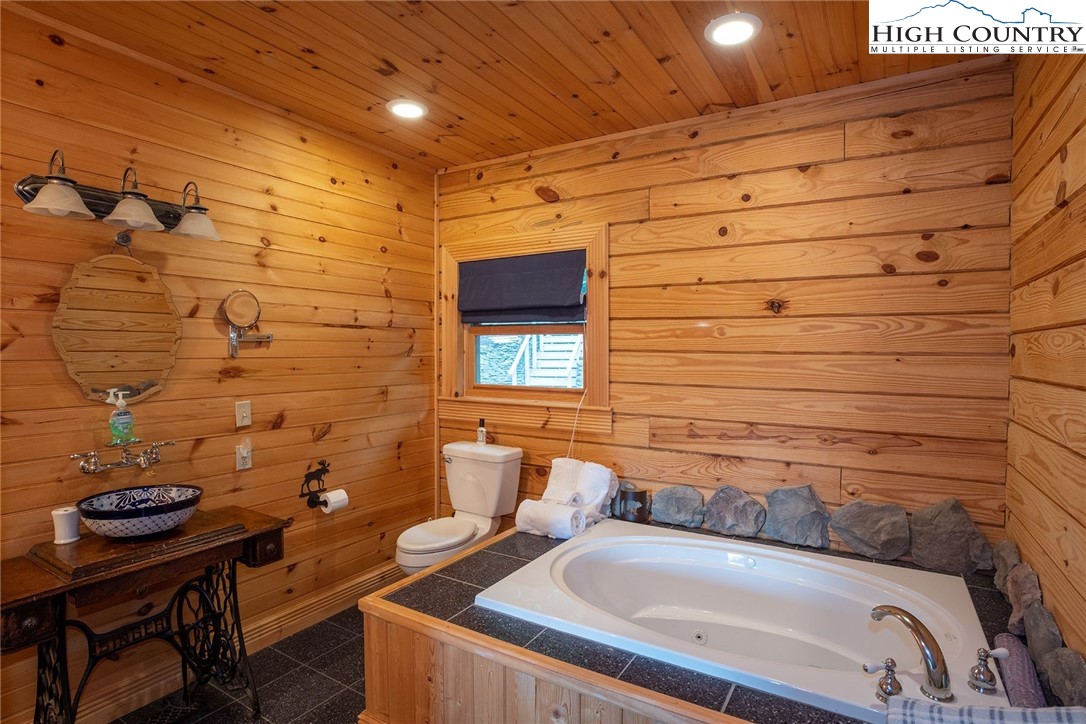 1082 Fox Cove Road Ferguson, NC 28624 - Photo 9 of 22 a bathroom with a sink and a mirror