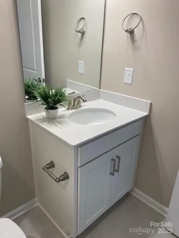 a bathroom with a sink and vanity