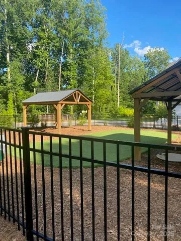 a view of a chairs and table in the roof deck