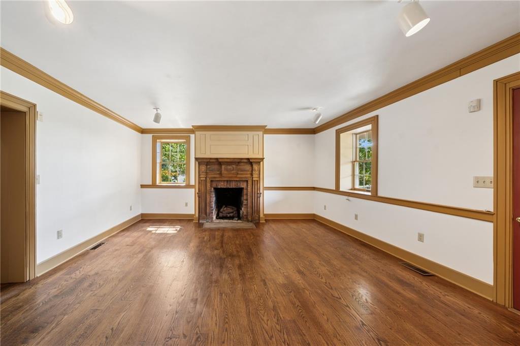 284 Eaton Run Road Jefferson, PA 15344 - Photo 11 of 41 a view of an empty room with wooden floor and a window