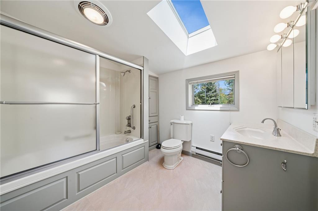 284 Eaton Run Road Jefferson, PA 15344 - Photo 15 of 41 a bathroom with a granite countertop sink a toilet and shower