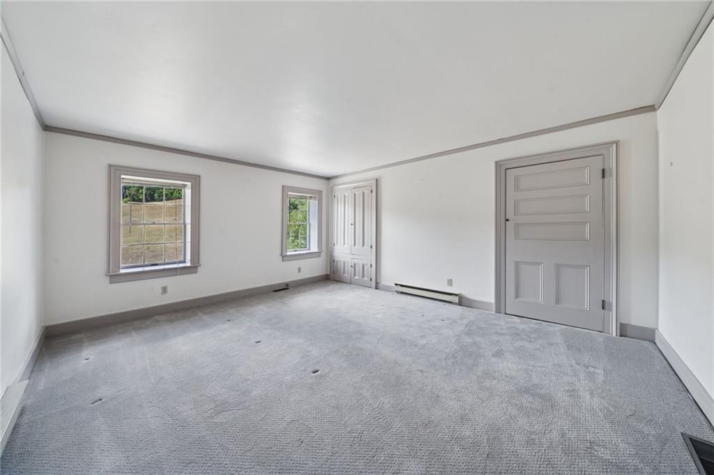 284 Eaton Run Road Jefferson, PA 15344 - Photo 18 of 41 an empty room with windows and closet