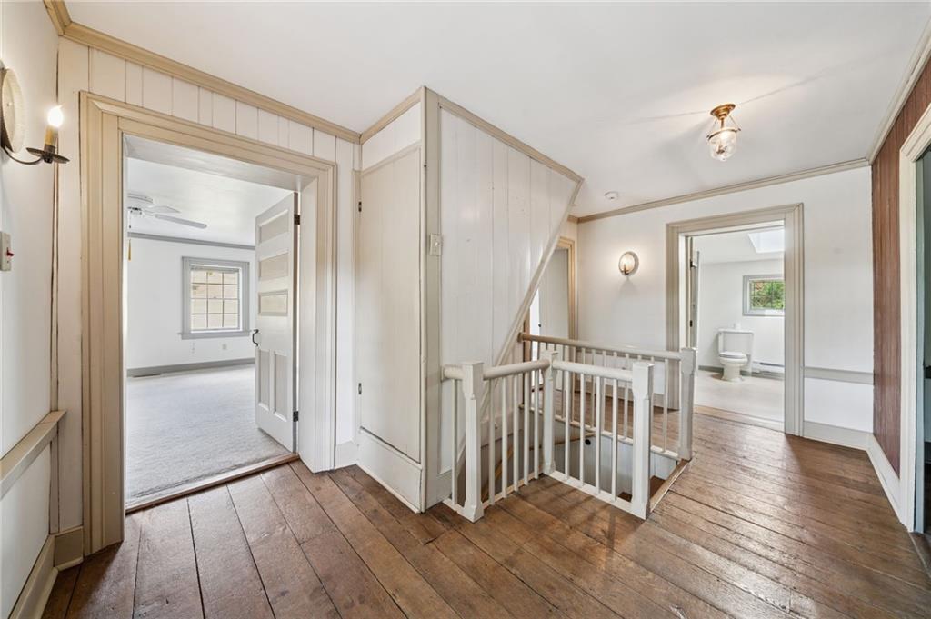 284 Eaton Run Road Jefferson, PA 15344 - Photo 24 of 41 a view of a hallway with wooden floor and stairs