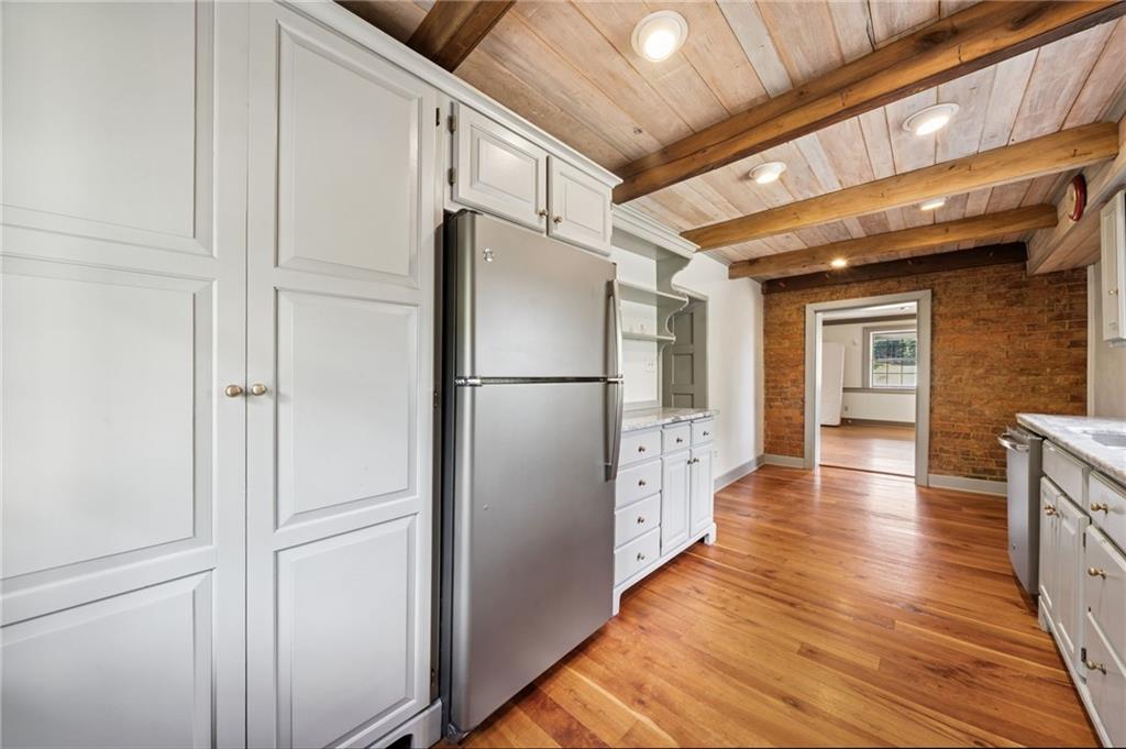 284 Eaton Run Road Jefferson, PA 15344 - Photo 26 of 41 a view of a hallway with wooden floor and cabinets
