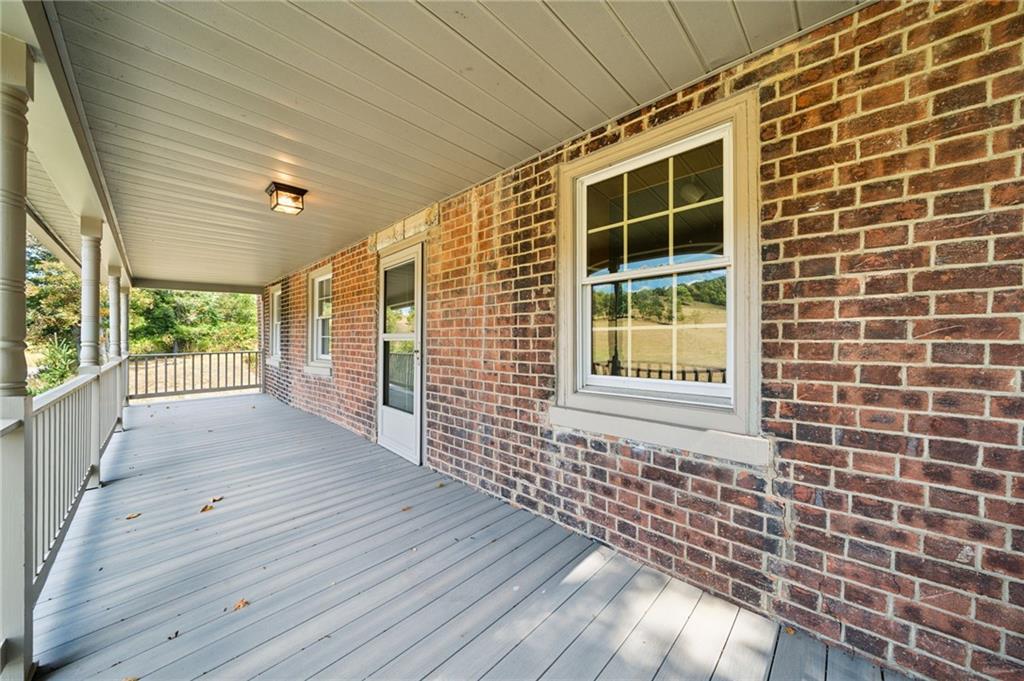 284 Eaton Run Road Jefferson, PA 15344 - Photo 30 of 41 a view of a porch with wooden floor