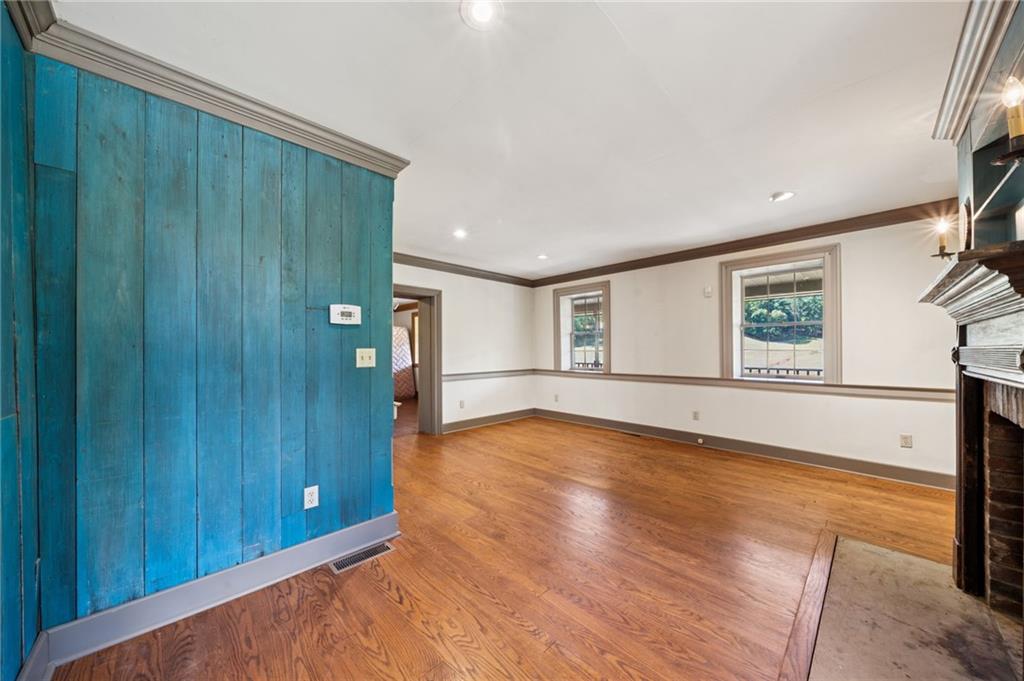 284 Eaton Run Road Jefferson, PA 15344 - Photo 8 of 41 a view of an empty room with a window and wooden floor