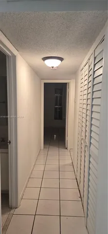 a view of entryway with a window and a fireplace